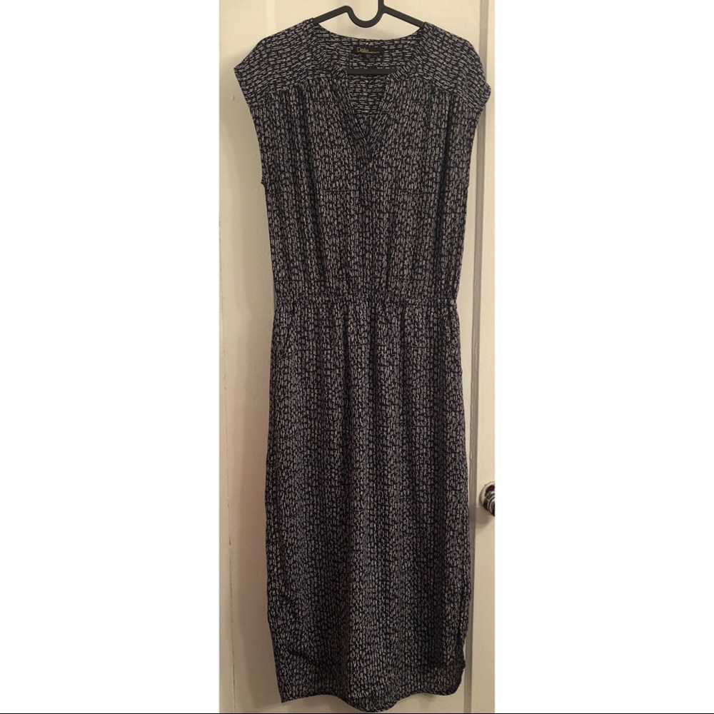 Blue calf-length dress w/ grey & white pattern.